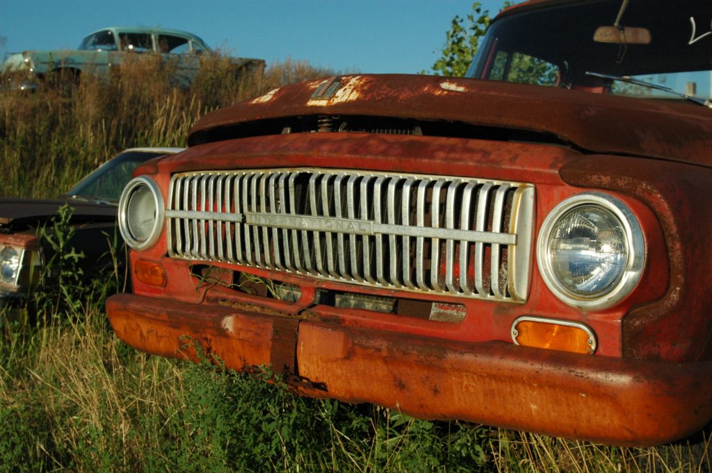 rusted brown pick up truck