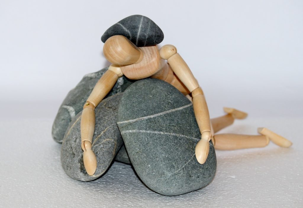 Rocks on a artist dummy, to show the weight of not being good enough.