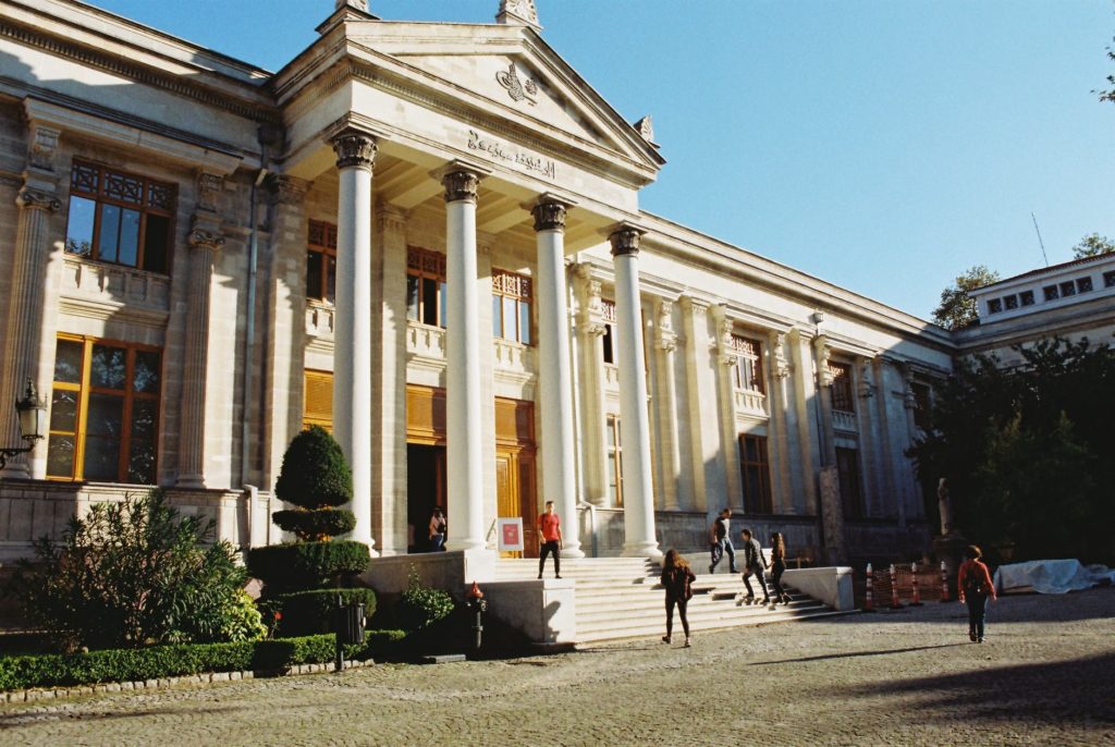 a building with pillars at the entrance