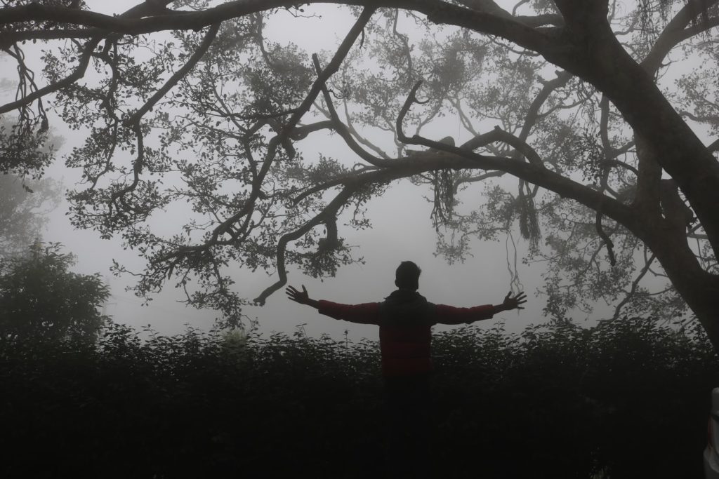 unknown person standing outdoors