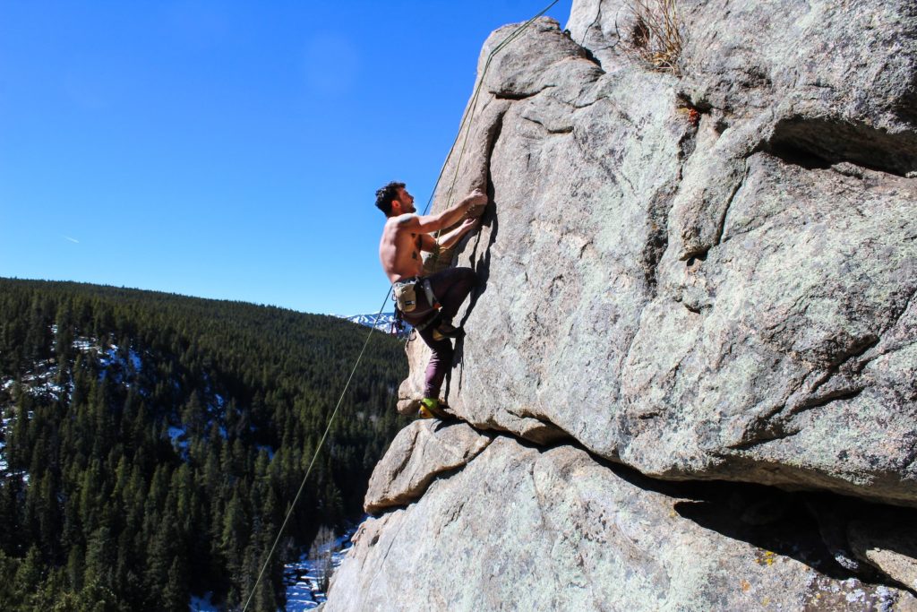 man rockclimbing at daytime. are you living your life on your terms?