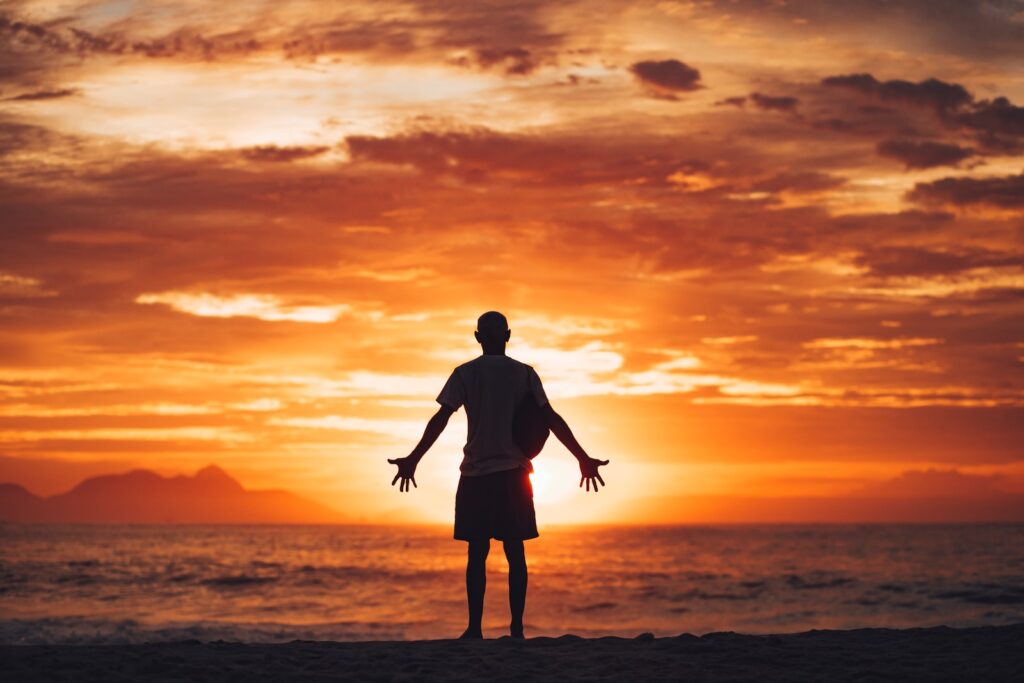 silhouette of man running on beach during sunset 
You can experience the light of self-improvement