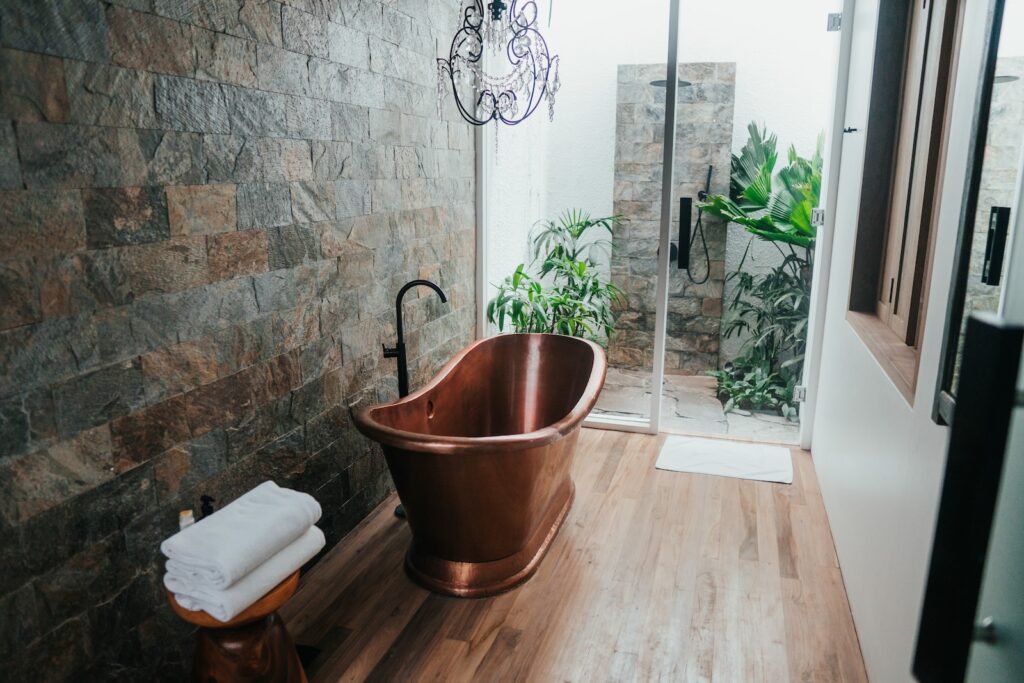 Copper tun near white framed glass door.